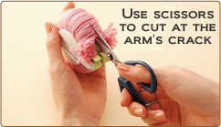 Use scissor to cut at the arm's gap